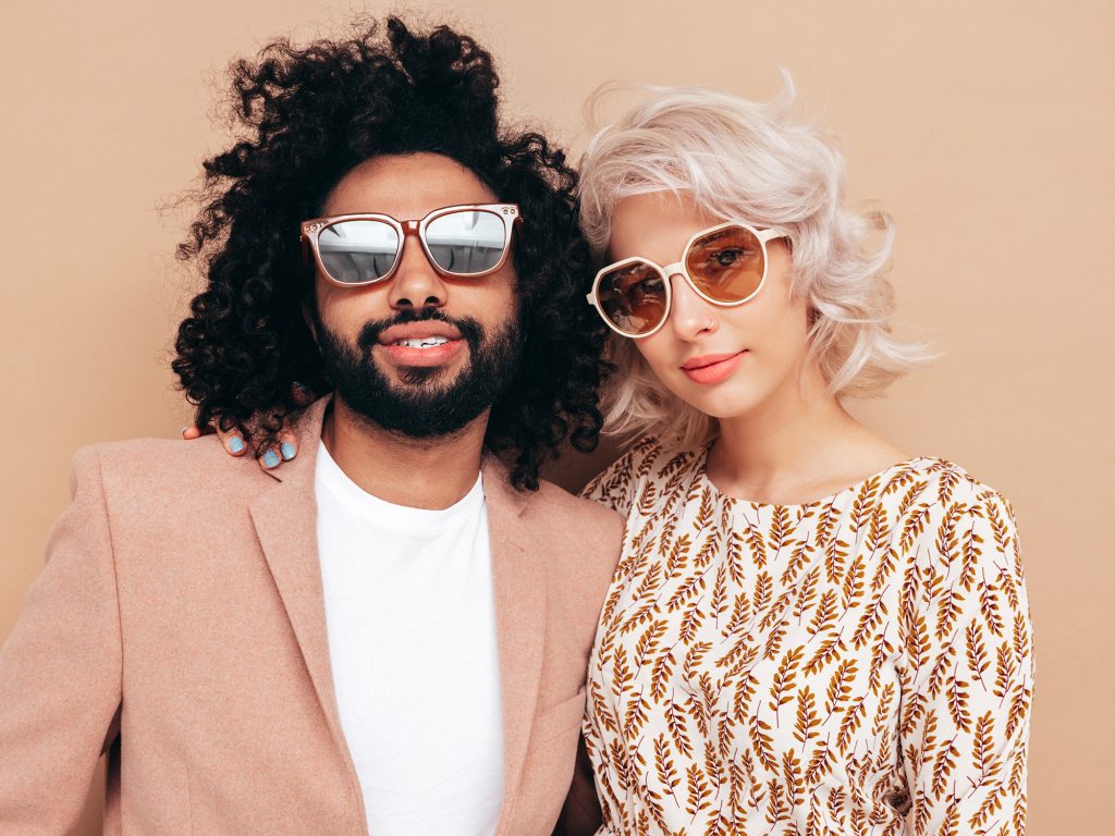 beautiful interracial couple wearing stylish glasses